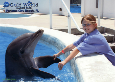 Abby greeting a dolphin