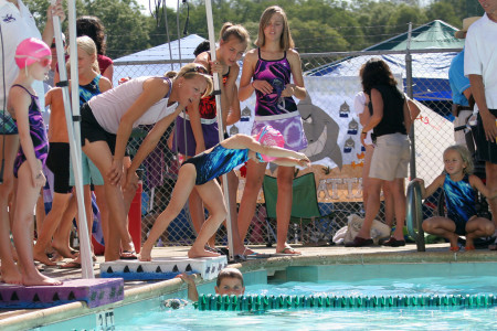 Dru diving at swim meet