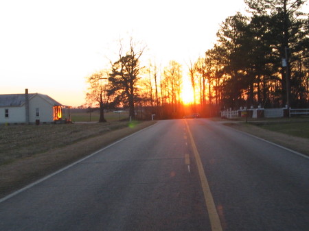 Setting sun on a country road.