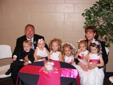 My husband and me with our 6 Grandchildren