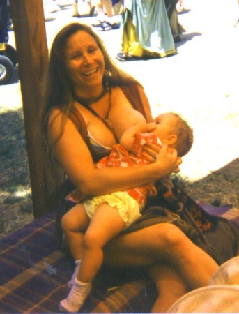 Amy nursing Venice at a Ren. Fair.