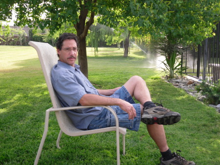 Bob sitting  in the  back yard