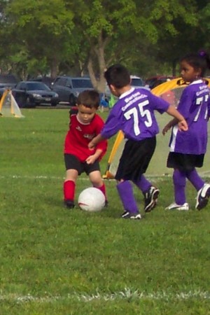 Alex playing soccer.