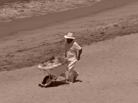 A guy selling stuff on beach, from my suite