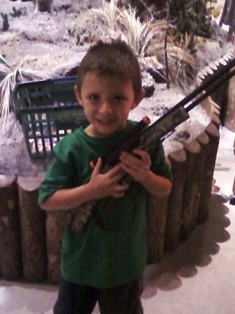 Daevin at shoot em up in sports store ,,thinks