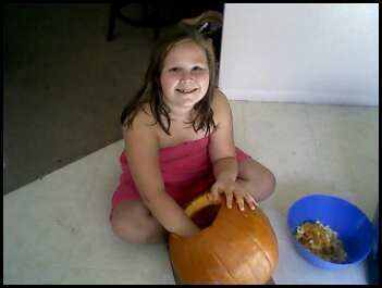 Punkin carving a Pumpkin