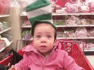 Gabby trying on a st. Patty's hat