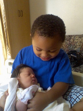 Dominic and his new baby sister