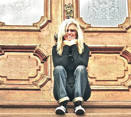 Suzie sits on steps: