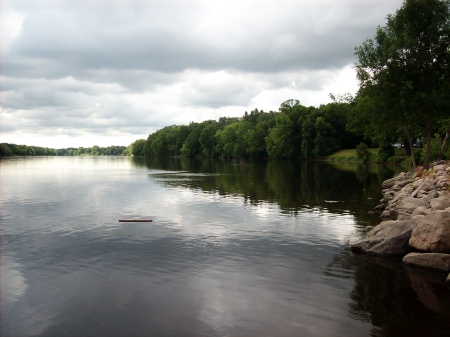 Land accenting a point where river meets sky