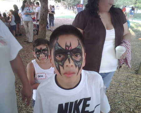my son got a face painting like batman