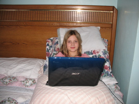 Rhiannon on her laptop