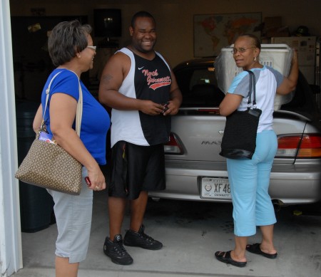 Cynthia,Marcus,and Me standing in the garage