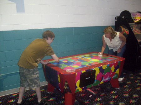 Ann & Son Jack playing air hockey