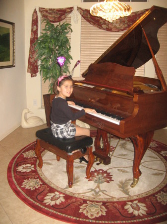 Miss Kiyah at her Papa's new piano!