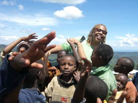 Denise with children in Burundi