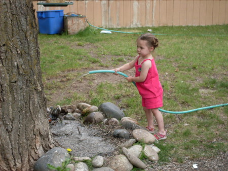 friend Riley watering our garden