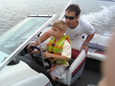 Dylan driving the boat