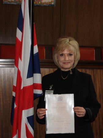 By the British Flag with Certificate