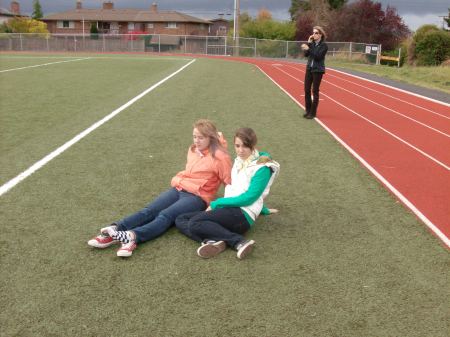 Zoe and Paige watching Roxy play soccer