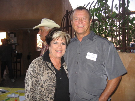 Kim Smith Larsen and husband with Rick Coker