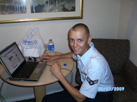 Justin enjoying my computer at my motel