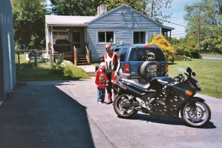 My Husband and Son outside our home