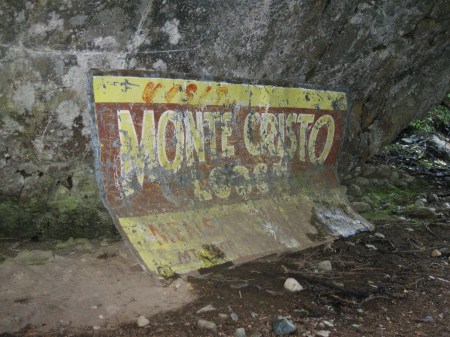 old sign on the side of the trail