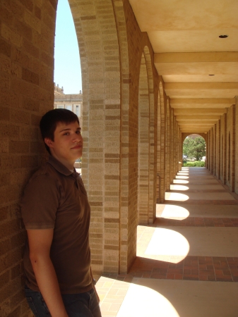 Nick in the arched entrance to Mass Comm bldg.