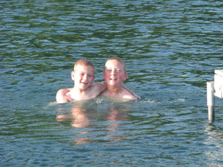Trey & Ian playing in our pond