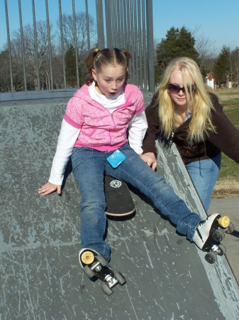 Elizabeth trying to skateboard