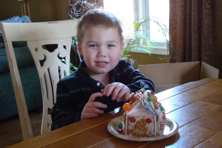 Peyton and his homemade gingerbread house