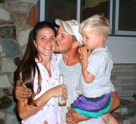 Katrina with hubby Tom... and son.  Awe!