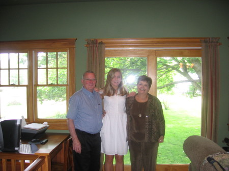 Emily with grandparents on Graduation day