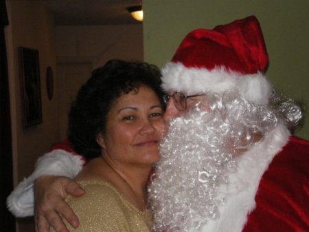 Mommy is kissing Santa Claus