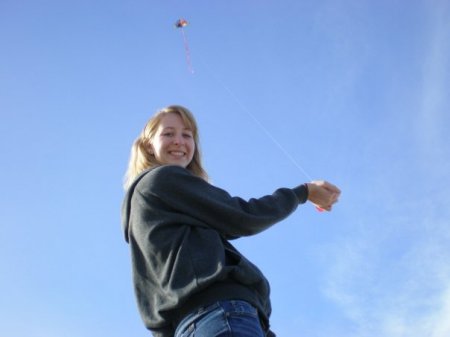 Hannah flying kite on Oregon Coast