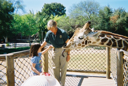 Hailee feeding a giraffe, Reid Park Zoo, Tucso