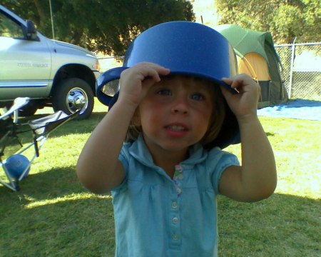 Amelia wearing a pot at camp.