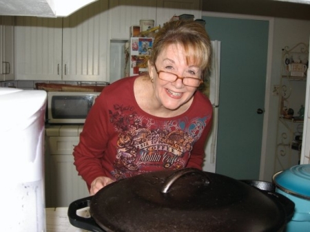 Wendy cooking in her kitchen. 2009