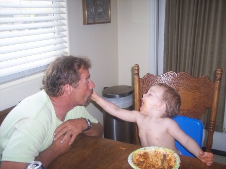 Joey my grandson feeding my husband Kenny