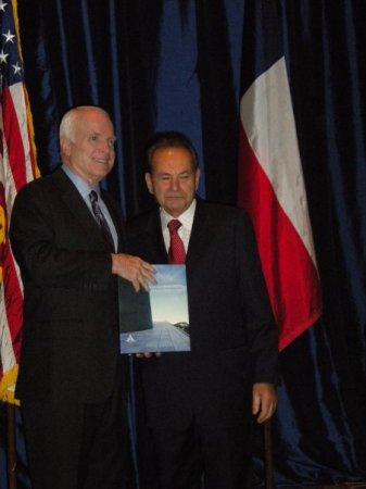 dad presents book to John McCain