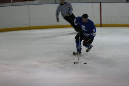 The defenseman has possession and control