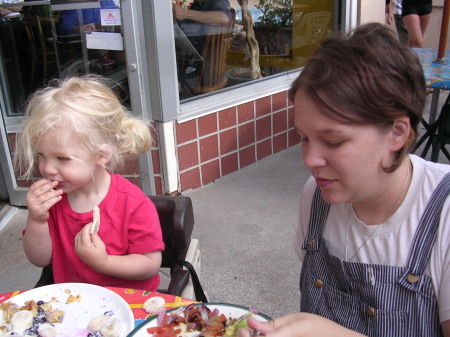 long-haired kid chowing down