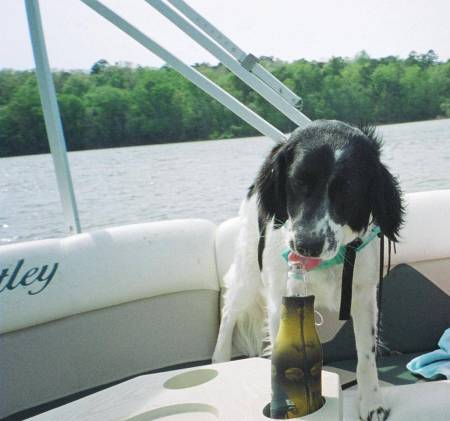 Riley having a beer while on a boat ride on th