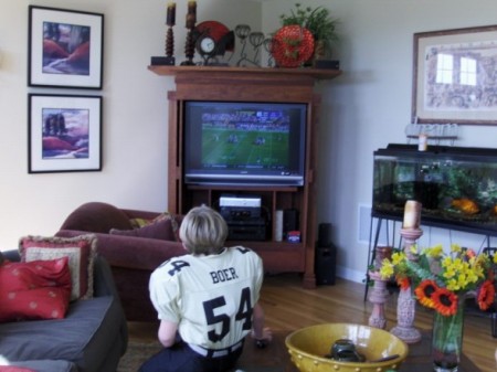 My son watching football in our home, just thought this was a great pic.