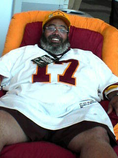 REDSKINS FAN IN POSITION TO WATCH THE GAME.