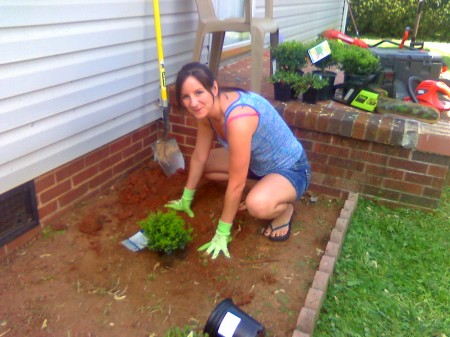 Terri planting flower beds for ME