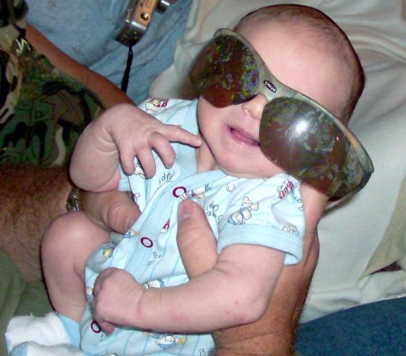 Wearing daddy's shades already!