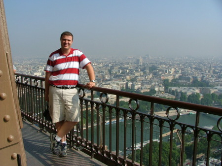 Me on the Eiffle Tower in Paris with the Arc De Triumph in the background - 6/30/06