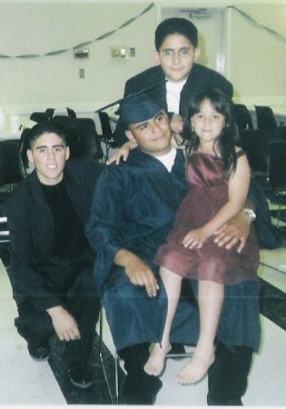 At Graduation party w/brothers & lil sister.